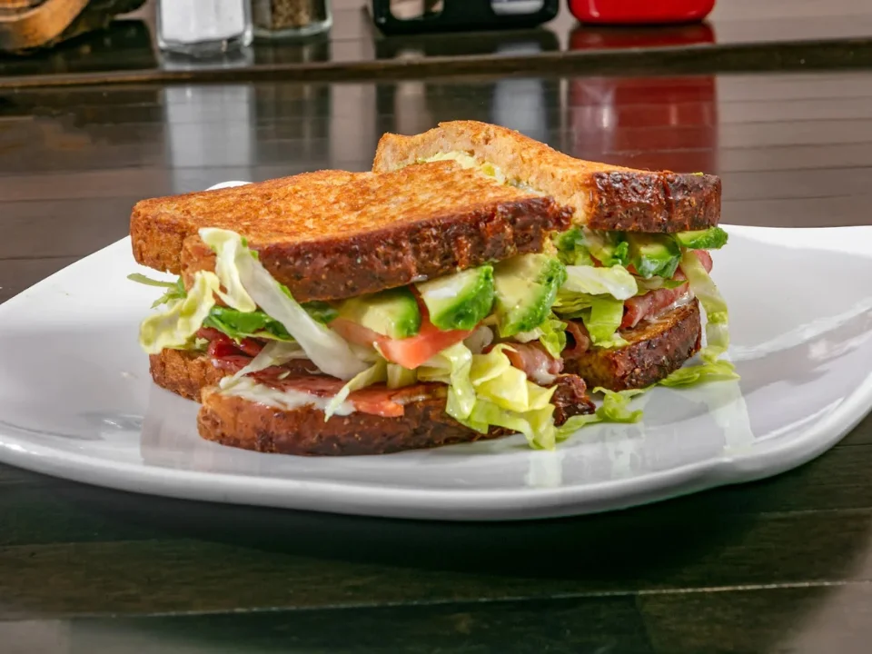 Avocado TBLT - Fresh avocado toast with turkey, bacon, lettuce and tomato
